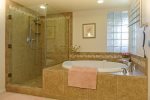 Ensuite bathroom with oval tub and walk in shower